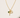 Debon Gold Charm Necklace close-up on neutral background showing gold cross, open heart, and emerald green stone details.