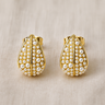 Gold teardrop stud earrings with pearl details on white linen backdrop, Dewdrop Stud Earrings.
