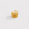 Dominike Ear Cuff in polished gold featuring a layered open cuff design with raised stud detailing, styled as a bold textured statement ear cuff on a clean neutral background.