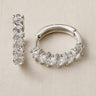 Dorian Huggie Earrings with faceted clear stones and polished silver huggie design
