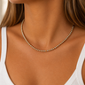 Eclat Necklace mixed gold and silver beaded necklace worn on neck, showing delicate minimal chain and close fit styling.