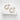 Small Emilia hoop earrings in polished silver finish displayed on white stone background