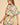 Side angle of Enus Top highlighting dropped shoulders, balloon sleeve shape, and airy cotton fabric.