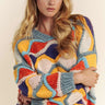 Bold knit design of the Eon Sweater with vibrant color waves.