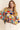 Eon Sweater styled casually with relaxed jeans, colorful knit design.