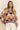 Close-up of Eon Sweater knit pattern in vibrant colors, detail view.