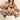 Model wearing Eon Sweater, multicolor knit with wave pattern, front view.