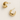 Evelina Hoops Earrings — small gold plated hoops on linen background, minimal, luminous, and elegant jewelry piece by Matte.