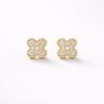 Fallon Stud Earrings featuring small floral cluster design with pavé-set zirconia stones in gold setting, displayed as a pair on a soft light gray background with subtle shadow, dainty everyday stud earrings
