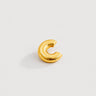 Fatima Ear Cuff in polished gold featuring a rounded dome silhouette with dotted textured detailing, designed as a modern sculptural statement ear cuff on a clean neutral background.