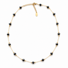 Flur Necklace gold plated necklace with black faceted beads on neutral background, showing delicate chain, warm tones, and adjustable extender