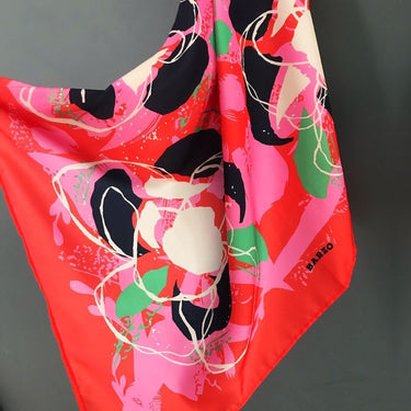 Galápagos Scarf in bright coral, pink, and emerald tones, tropical artistic print, square scarf photo for Matte.
