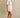 Godeth Blouse white eyelet short sleeve blouse worn with matching scalloped shorts, showing button-front design and relaxed summer fit