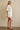 Godeth Blouse white eyelet short sleeve blouse worn with matching scalloped shorts, showing button-front design and relaxed summer fit
