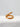 Close-up of gold Infinite Loop Ring with sculptural design
