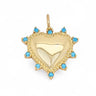 Greter Pendant in gold with turquoise stone detailing, heart-shaped charm on a light gray background with soft shadow