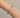 Haddy Bangle Bracelet silver twisted cable bracelet worn on wrist with polished horseshoe clasp detail, modern stainless steel cuff design with sleek luxury finish and minimalist styling.**
