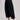Side view of High-Rise Pleated Culotte Pants in black with wide leg silhouette and pleated design