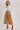 High-Rise Pleated Culotte Pants in taupe, pleated wide-leg cropped pants styled with fitted turtleneck sweater