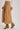 Side view of High-Rise Pleated Culotte Pants in taupe with structured pleats and flap front pockets