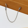 Imma chain huggie stud earrings in gold filled design with delicate connecting chain on wood and white background