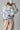Back view of Indigo Bloom oversized sweatshirt in indigo with ivory floral print.