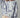Model wearing Indigo Bloom oversized sweatshirt with ivory floral print.