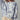 Model wearing Indigo Bloom oversized sweatshirt with ivory floral print.