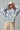 Indigo Bloom oversized floral sweatshirt styled in streetwear outfit.
