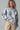 Indigo Bloom oversized sweatshirt styled with beige corduroy pants.