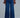 Front view of indigo wide leg jeans with high-rise waist and structured denim fit