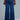 Front view of indigo wide leg jeans with high-rise waist and structured denim fit