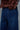 Close up of indigo wide leg jeans showing back pocket stitching in classic denim style