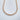 Styled flat-lay Isabella gold filled cubic zirconia tennis necklace – Matte