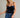 Isti Top strapless navy velvet top front view with jeans.