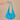 Jaspe Beach Bag in vibrant turquoise cotton with fluid slouchy silhouette and wide strap, designed with a gathered base and soft drape
