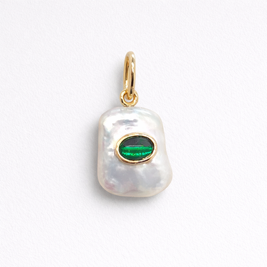 Julian Pearl Charm baroque freshwater pearl with green onyx detail on gold setting isolated on light background.
