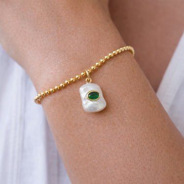 Julian Pearl Charm worn on gold chain close-up styling layered delicate jewelry.