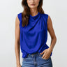 Kian Top worn by model, front view, featuring blue sleeveless draped neckline and soft flowing silhouette