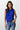 Kian Top worn by model, front view, featuring blue sleeveless draped neckline and soft flowing silhouette