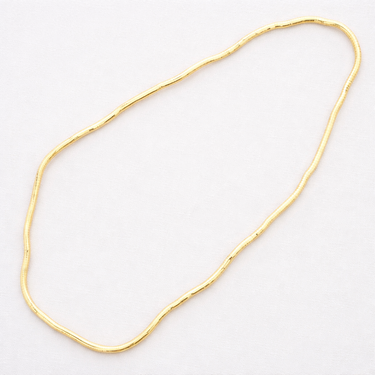 Kime Flexible Necklace flexible gold necklace stretched out.