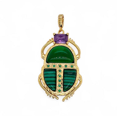 Kina Pendant gold scarab pendant with green stone center and zirconia accents close-up highlighting symbolic design and vibrant gemstone contrast.