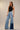 Kowloon Jeans worn by model, front view, featuring high-rise waist and contrasting denim panels