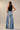 Kowloon Two-Tone Wide-Leg Jeans worn by model, full body back view, showing relaxed fit and full-length silhouette.