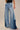 Kowloon Jeans worn by model, front view, featuring high-rise waist and contrasting denim panels.