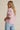 Lad Shirt pink shirt and denim outfit side view showing relaxed silhouette.