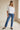 Lad Shirt white cotton shirt full-body outfit view with jeans and casual styling.