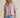 Lad Shirt styled with light pink shirt and blue jeans front view on model.