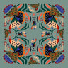 Le Mans Scarf with abstract artistic print in green, orange and blue tones, square silky scarf photo for Matte.
