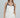 Model wearing the Lennon two-tone ivory satin cami with black faux-leather accents.
